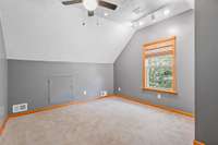 upstairs office area with closet