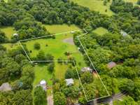 3.4 acres set up perfect for a mini-farm, garden and room to play.