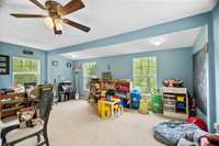 Great flex space just off the living room/breakfast area perfect for another living area, den, playroom or craft area. Lots of natural light!