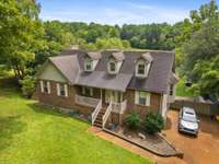 House has 3 levels of living and plenty of shade and open areas.