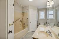 Primary Bath has its own linen closet and additional cabinet storage behind the door.