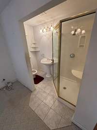 Primary bathroom featuring walk in shower
