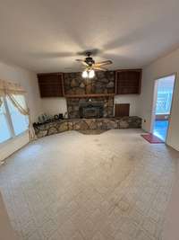 Living room with custom stone fireplace