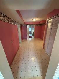 Hallway to primary bedroom and main bathroom