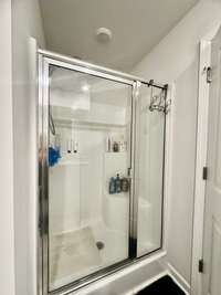 Primary Bath has fiberglass shower and 2 closets