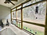 Covered Screened patio overlooking backyard with privacy treeline! Enjoy sunrises and sunsets! HOA includes exterior maintenance, landscaping and community playground.