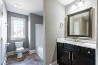 Bedroom 4 has a large bath that is also accessible by the hallway for guests who are using the upstair common areas.