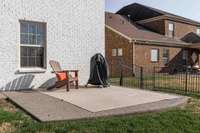 Rear concrete pad that can be used for a grilling area, dining area, or go big and put your hot-tub here!