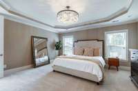 Primary Bedroom on Main level. This room has new carpet and a gorgeous new chandelier.