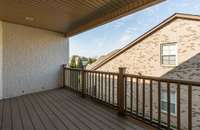Upstairs covered balcony is perfect for enjoying the night sky.