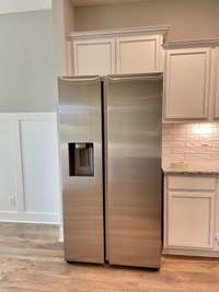 Stock photo showing that This home also comes with a double door refrigerator!