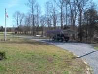 additional covered carport to store your toys or extra vehicles!