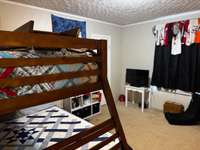 bedroom 2 with so much room, this is a twin over queen bunkbed and there is so much floor space left!