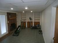 basement rec room with fireplace