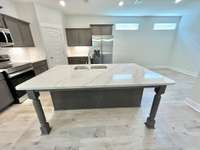 Love the large island and the breakfast area off in the back left corner. Stock photo