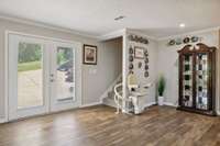 Double glass doors offer great access to parking area. The entire lower level is Handicap accessible & even offers a stair lift already installed for family or friends, if needed.