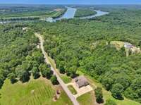 Views of the beautiful gated community & majestic river that encapsulates the property.