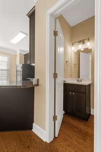 View of half bathroom adjacent to kitchen and living room on the second floor