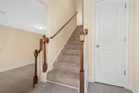 Front door entry is to your back in this photo. Bonus Room left. Coat closet right. Staircase to Living Room and Kitchen.
