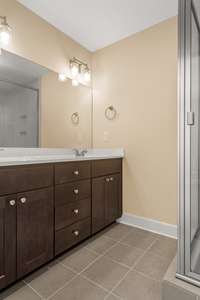 Double Vanities and Tile Flooring in Primary Suite