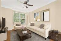 Living Room is on the second floor and wide open to the kitchen.  This photo is virtually staged
