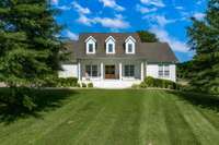 Many custom features -Marble counter tops, Updated lighting, Walk in Kitchen Pantry, Tiled showers, Outdoor space with fireplace and gas logs, TV hook up... many more