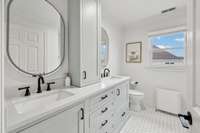 Additional Renovated Guest Bathroom on 2nd Level with Dual Vanity, Tile Shower/Tub Combo with Glass Door & Tile Flooring