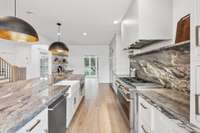 Mitered-Edge Quartzite Countertops & Backsplash, Coffee Bar, Custom Cabinetry & Range Hood