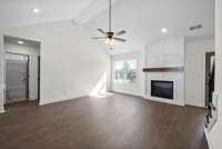 The doorway leads to two bedrooms and a full bath.