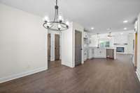 Dining area looking into kitchen and foyer hallway.