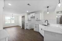 Kitchen has pantry, eat in area and bar area.