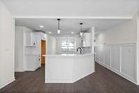 The custom trim work accentuates the hall as you enter the home.