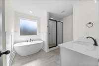Freestanding tub and a tile shower to enjoy.