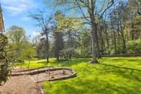 What a great view! Backyard extends into the wooded area.