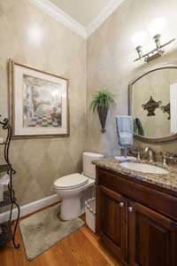 Powder Room with furniture vanity sink.
