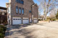 Plenty of driveway area outside the 3 separate garages plus guest parking near the front sidewalk.