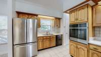 A different view of the kitchen showcasing stainless steel appliances.