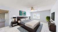 Professionally staged photo of the primary suite.  (Stage photo)
