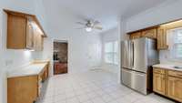 Another perspective of this roomy eat-in kitchen, bathed in abundant natural light that flows throughout the home.