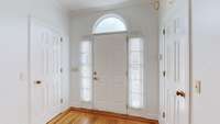 Hardwood flooring in the foyer.