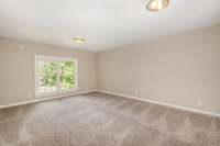 The largest upstairs bedroom features a generous layout, large closet, and its own half bath, ideal as a guest suite, playroom, or private office.