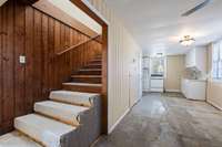 Inside unit B there is a foyer and living room area.