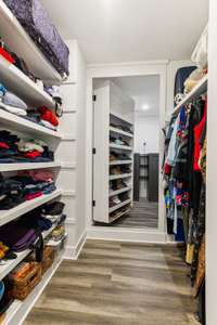 2nd larger, Primary closet with hidden door behind shoe rack
