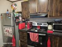 Comes with Stove, Refrigerator & Dishwasher