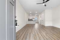 Spacious and bright living area with sleek flooring and an open concept layout. Perfect for everyday living or entertaining guests.