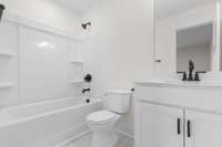 Stylish vanity and full tub/shower combo off the 2nd bedroom