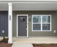 Charming curb appeal with a clean, modern facade and welcoming front entry, your new home awaits!