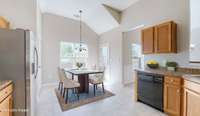 Kitchen breakfast area with view of backyard