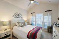 Large guest bedroom with cathedral ceilings