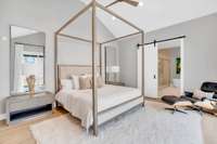 This additional angle of the primary suite highlights its calm, curated aesthetic.